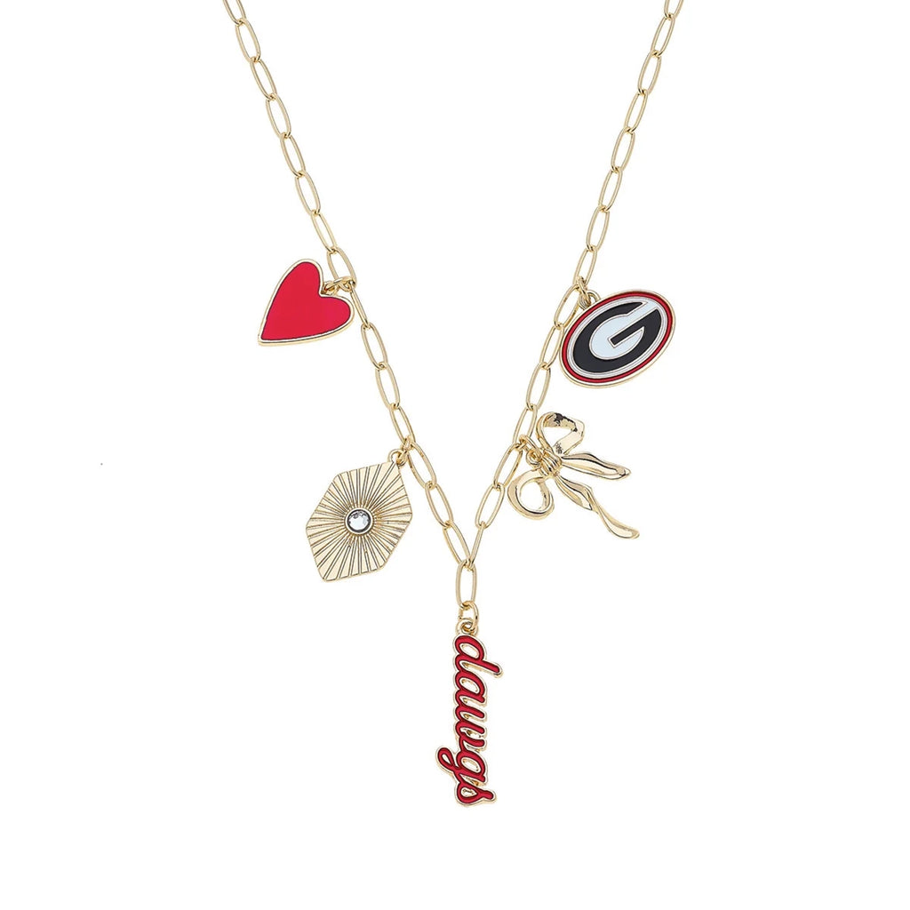 Gameday necklace featuring gold chain with charms including heart, scissors, and 'dawgs' pendant.