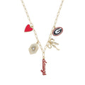 Gameday necklace featuring gold chain with charms including heart, scissors, and 'dawgs' pendant.