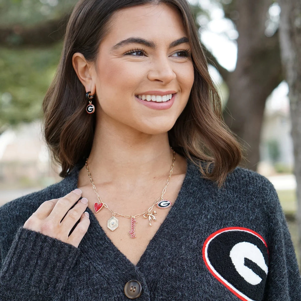 Model wearing a gameday necklace, showcasing stylish sports fan jewelry for game day.