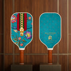 Front and back view of the RallyStand premium floral and monogram print pickleball paddles showcased on luxury dark wood retail display stands.