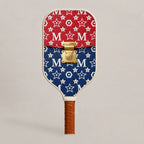Front view of a luxury RallyStand pickleball paddle featuring a college red, white, and blue designer handbag aesthetic with gold hardware accents.